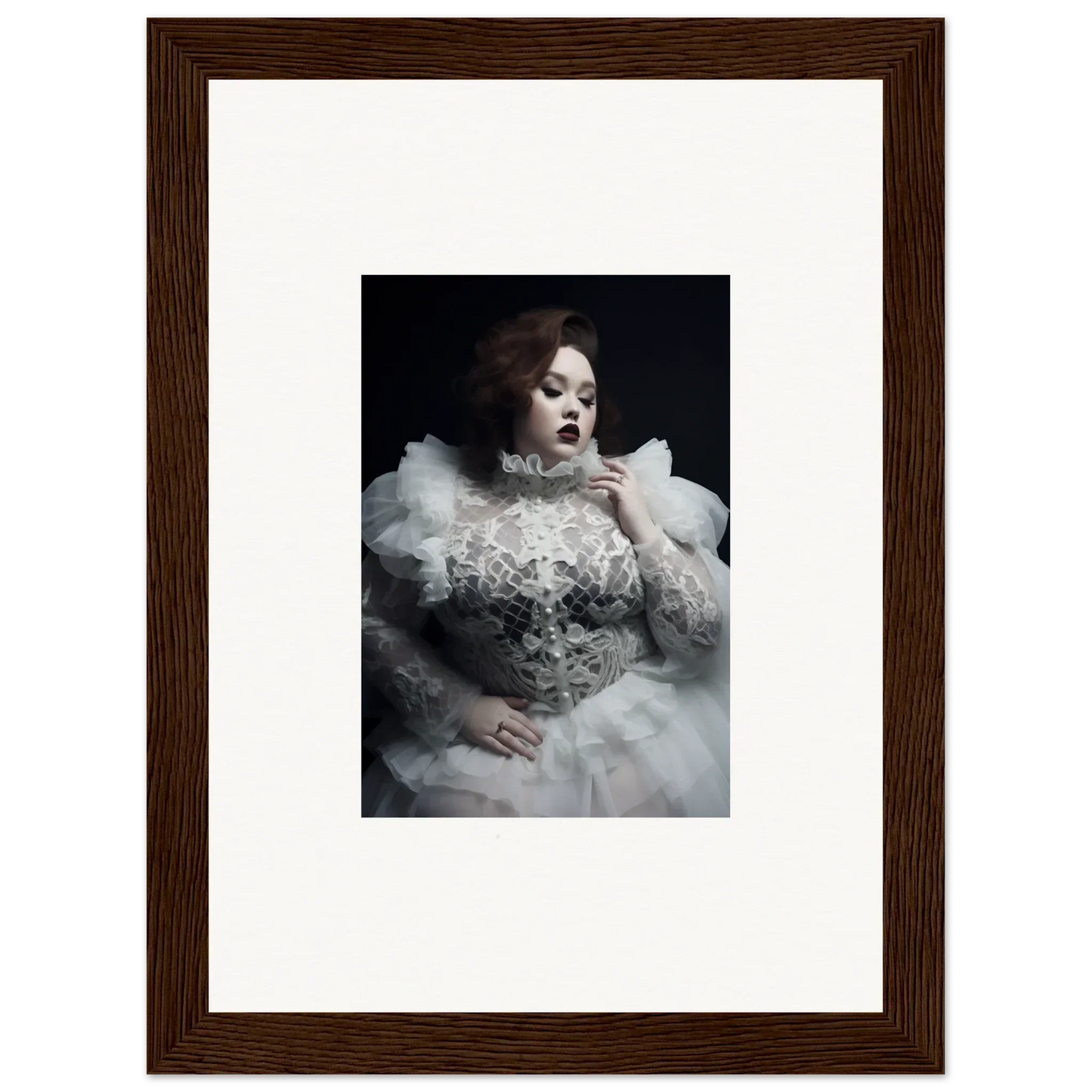 Framed portrait photograph of a woman in an elaborate white gown with voluminous ruffles and lace details.