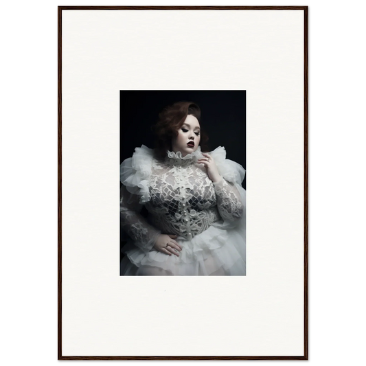 Dramatic portrait of a woman in an ornate white gown with voluminous ruffles and lace details.