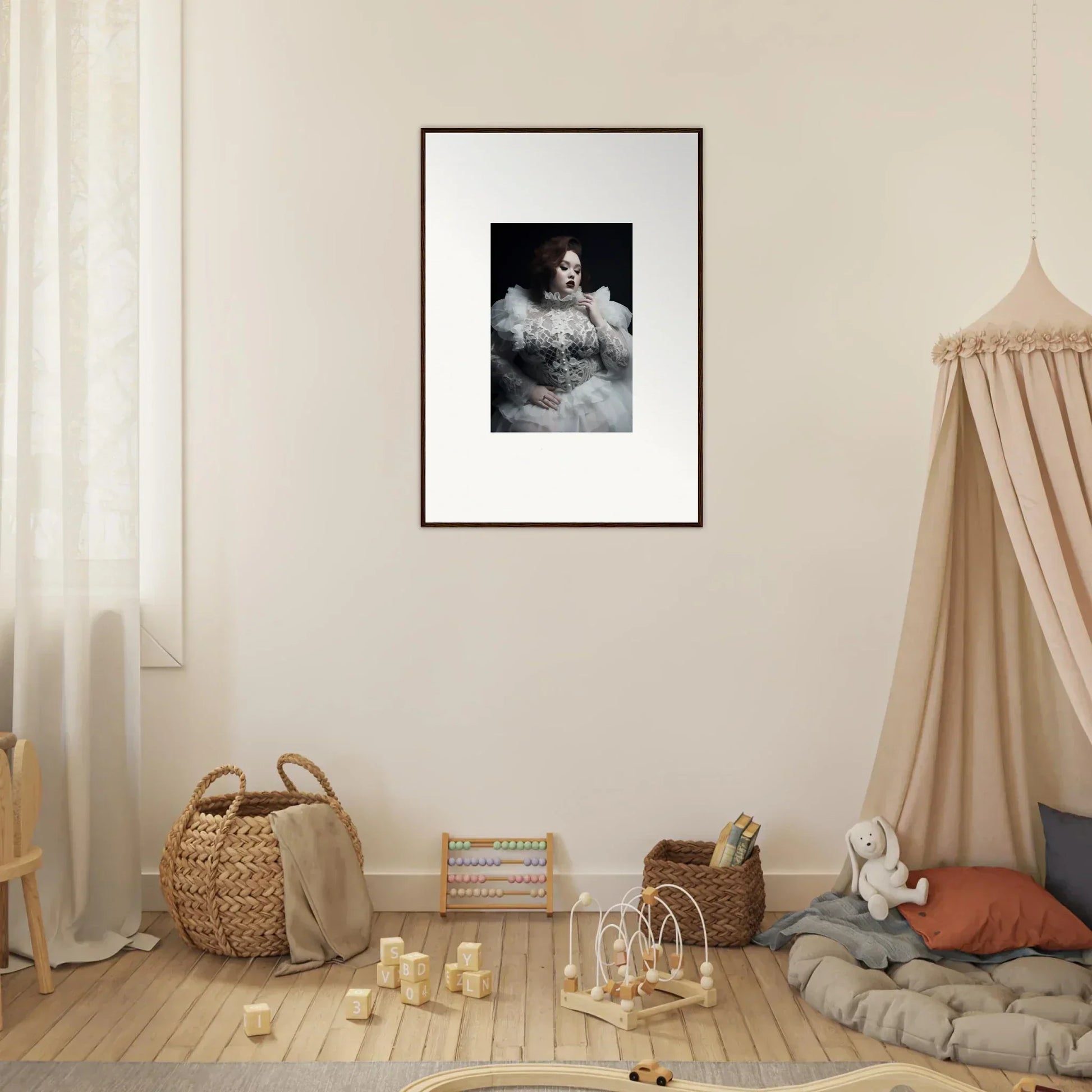 Framed black and white portrait photograph of a person in a feathery or fluffy garment.