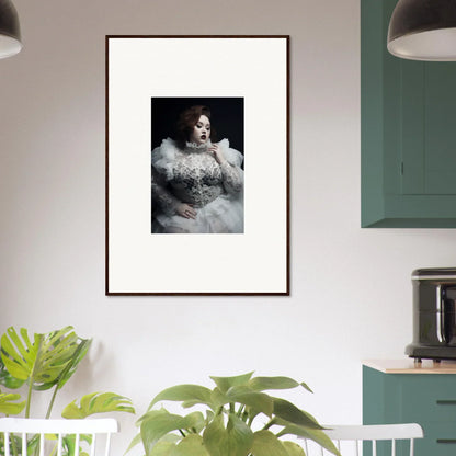 Framed portrait photograph of a person wearing an elaborate white feathered outfit against a dark background.