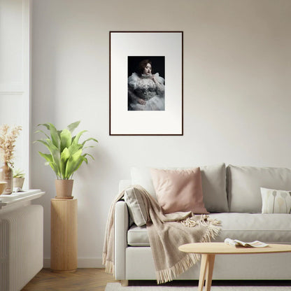 Framed black and white portrait photograph of a woman in an elegant dress.