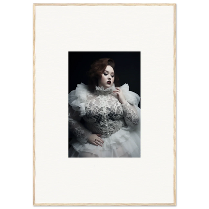 Portrait of a woman in an ornate white gown with voluminous ruffles and lace details.