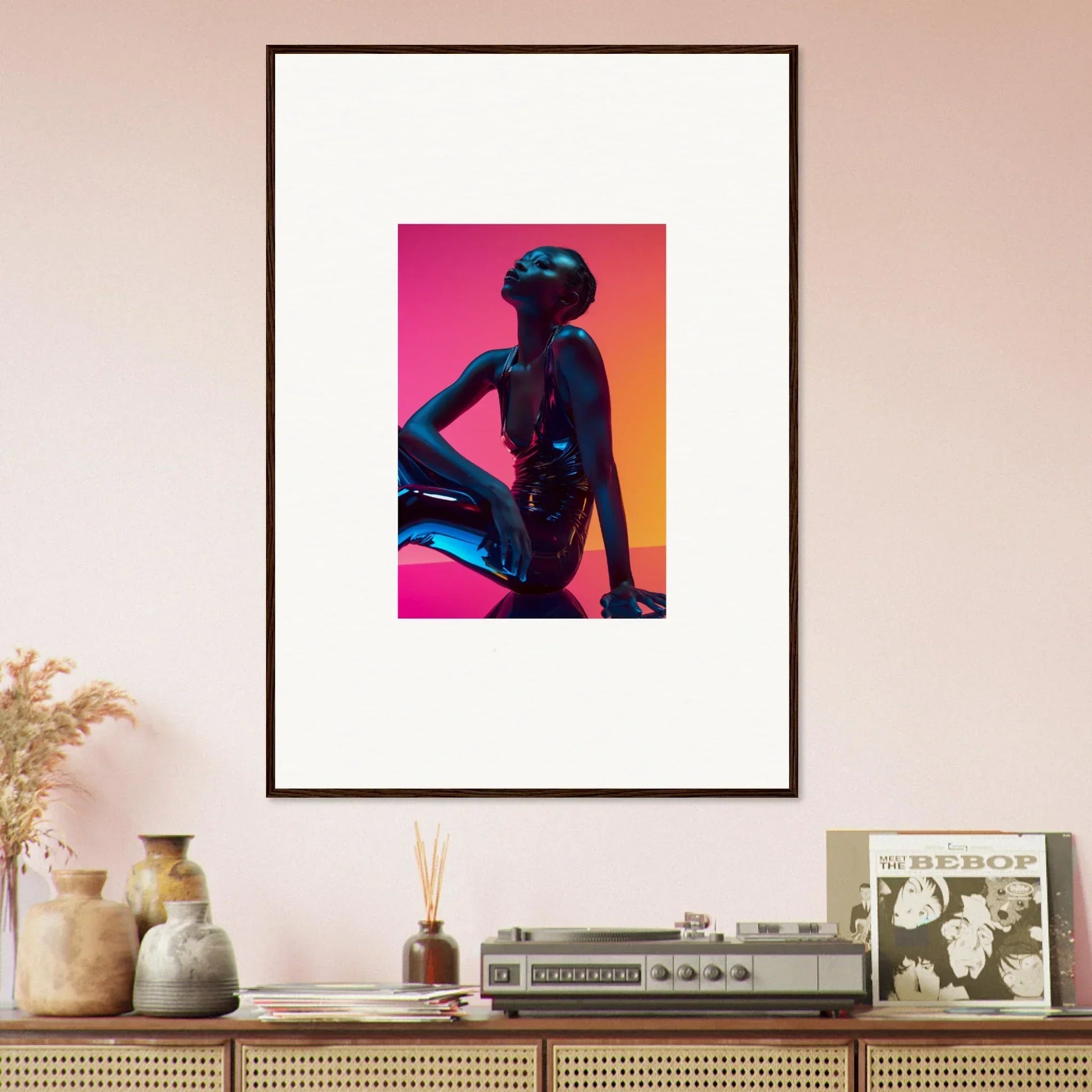 Framed wall art featuring neon echoes silhouette on vibrant pink and orange background