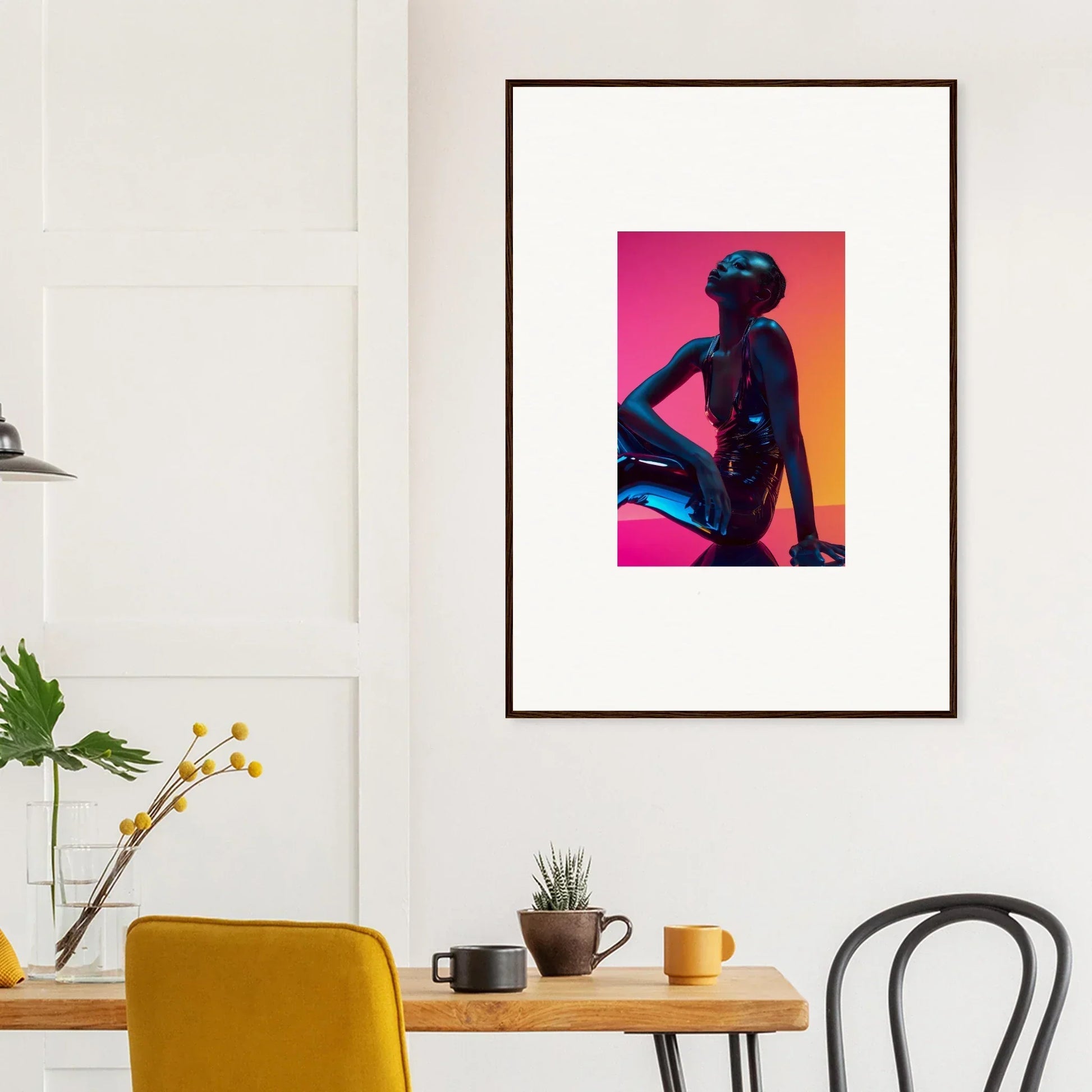 Framed wall art featuring a silhouetted figure in vibrant pink and orange neon echoes