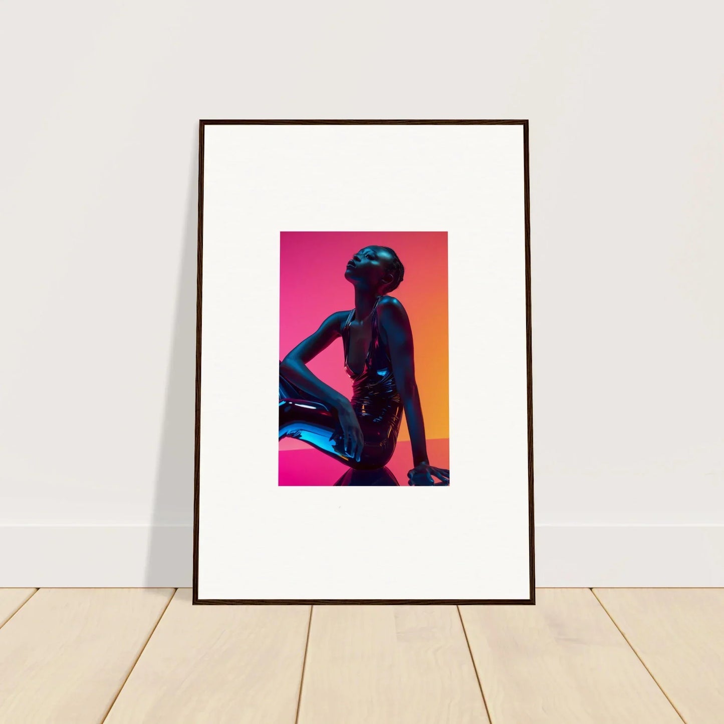 Framed wall art featuring neon echoes of a silhouette on a vibrant gradient background