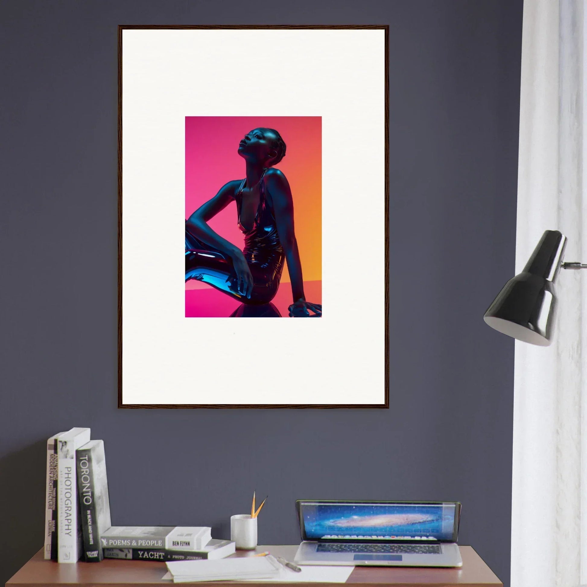 Framed wall art featuring a silhouetted figure in neon echoes on a vibrant background