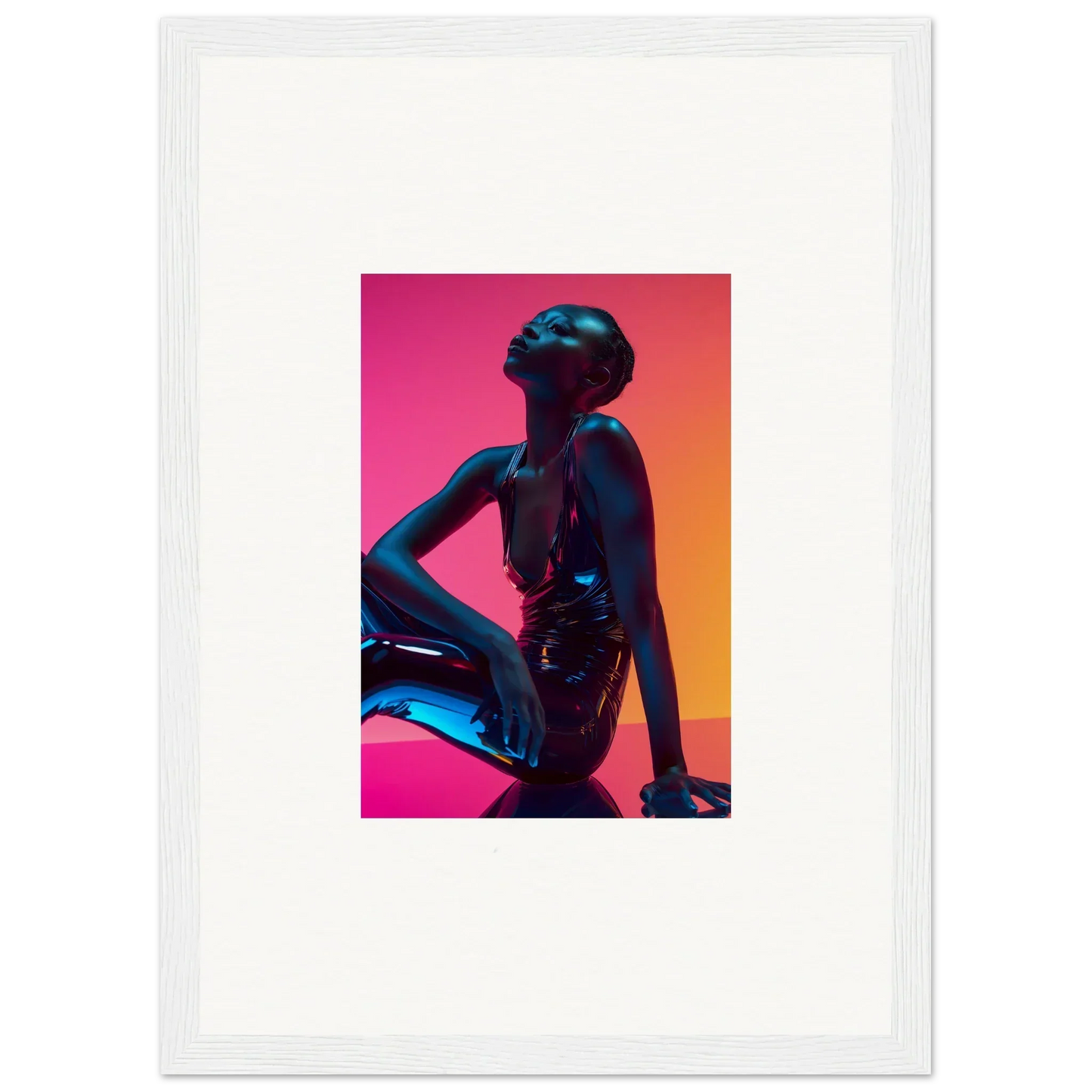 Silhouette of a person in a seated pose with vibrant pink neon echoes wall art