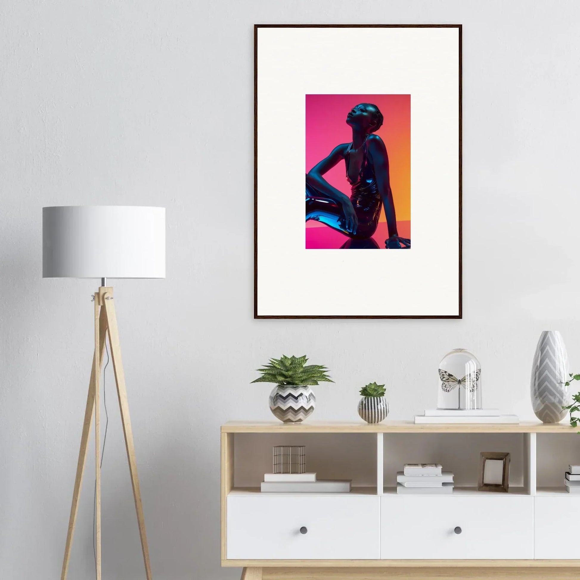 Framed wall art of a silhouetted figure with vibrant neon echoes for stylish room decor