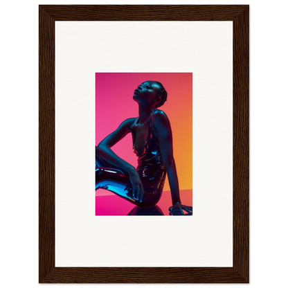 Framed wall art of a silhouetted figure with neon echoes in pink and orange hues