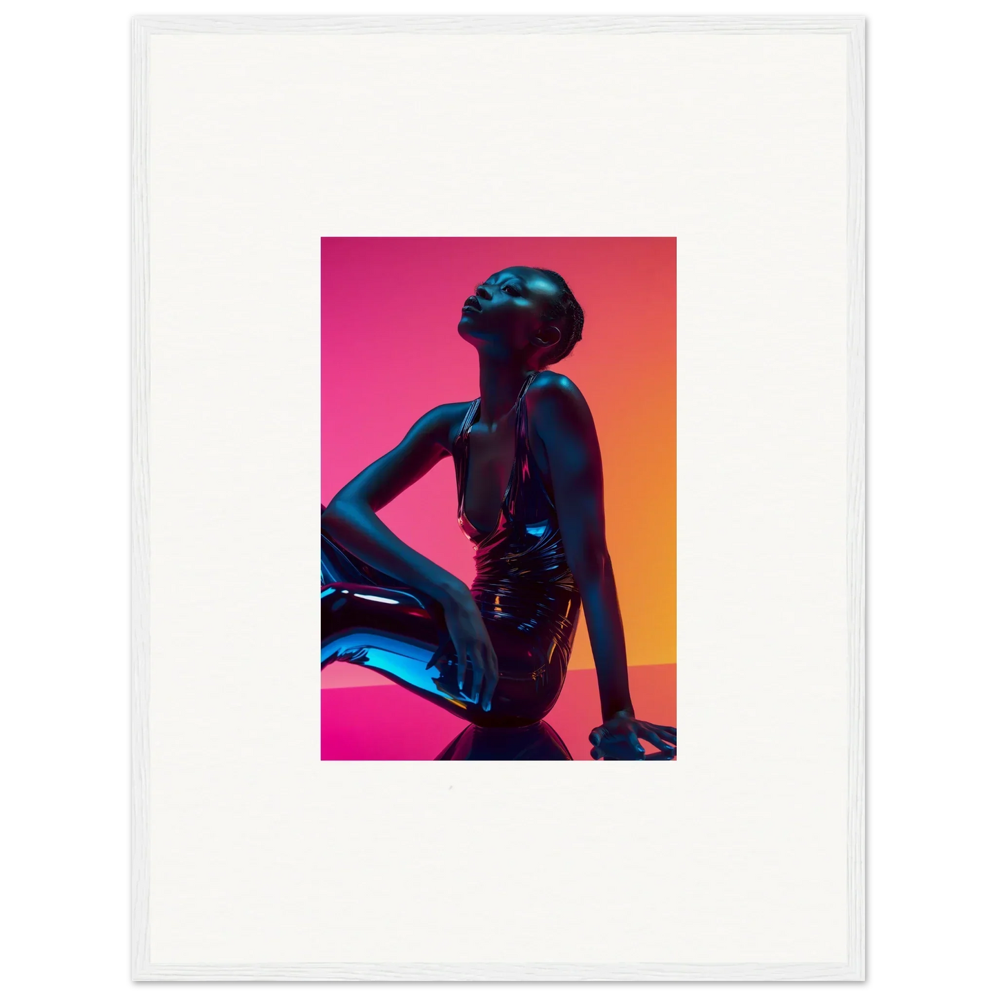 Silhouette of a seated figure with upturned face in vibrant neon echoes wall art