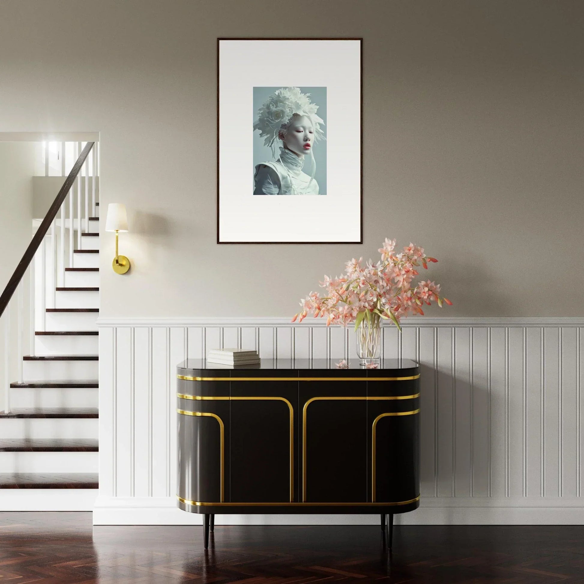 Framed portrait above a chic black and gold sideboard for stylish room decoration