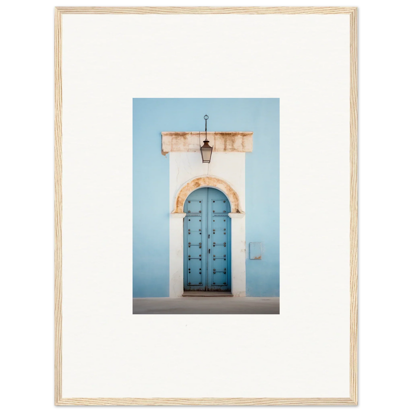 Ornate blue wooden door with studs under stone archway from Ethereal Portals Imagined