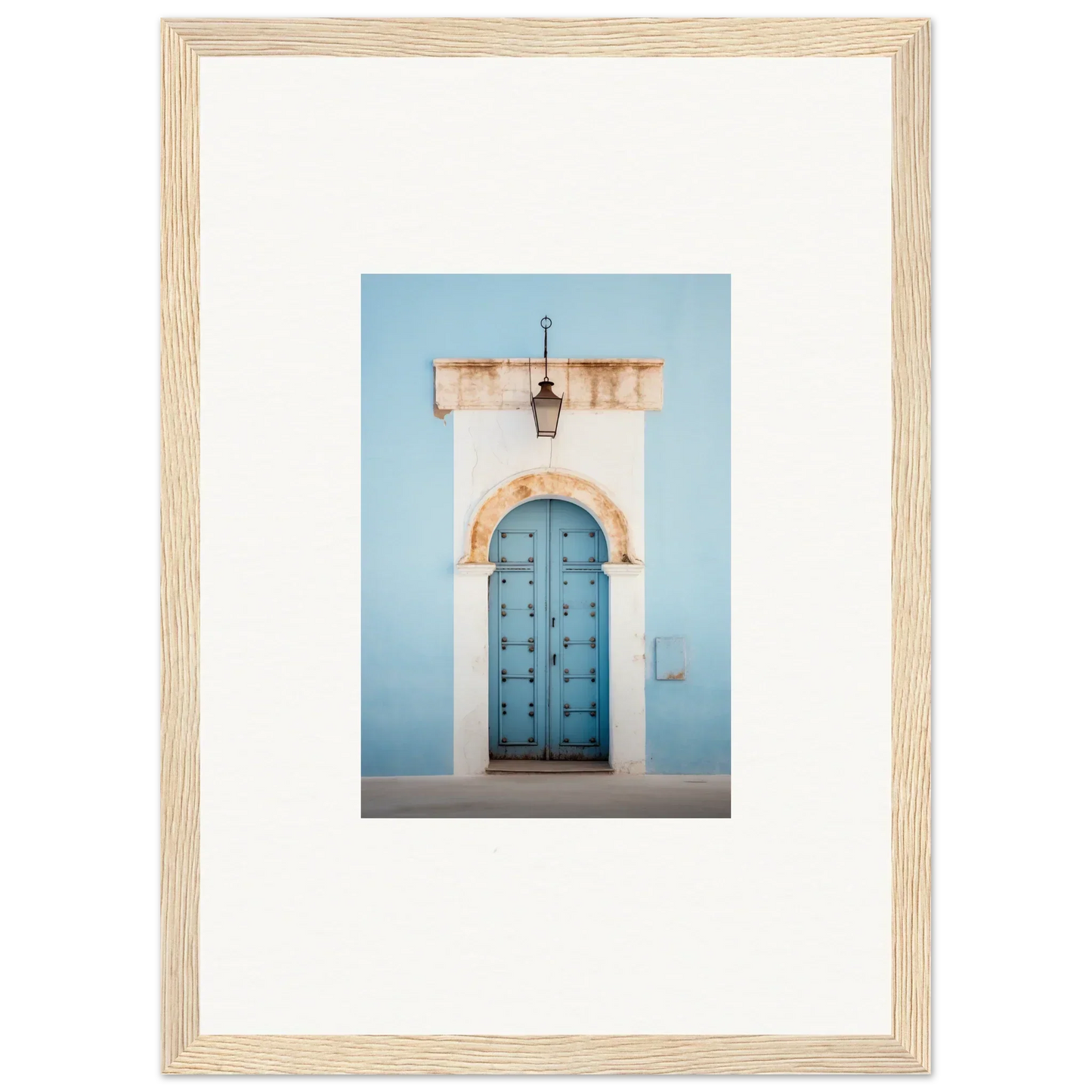 Light blue wooden door with studs in a white stone archway from Ethereal Portals Imagined