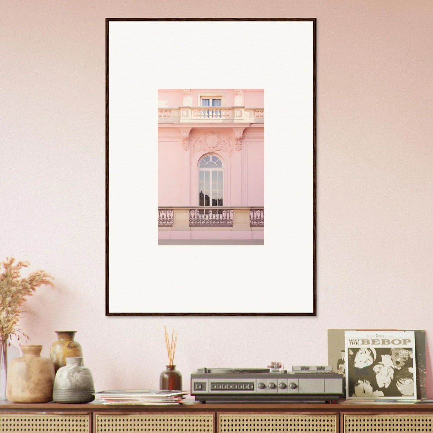 Framed photograph of a pink building’s balcony with an arched window, Ethereal Rose Whispers