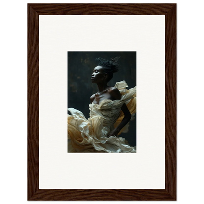 Framed portrait photograph of a person with dark skin wearing flowing white fabric.