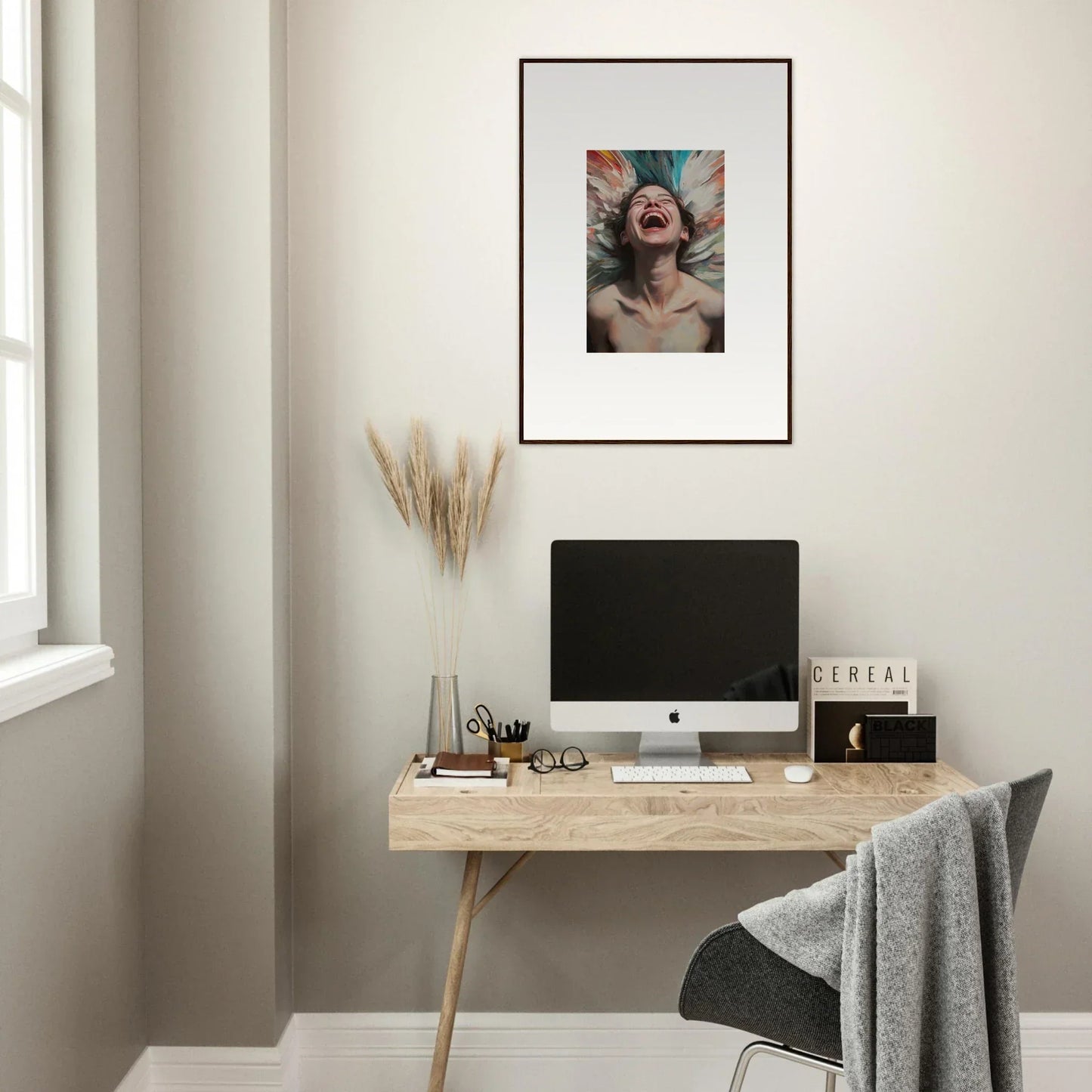 Minimalist home office with wooden desk, computer, and Aura Bloom canvas print decor