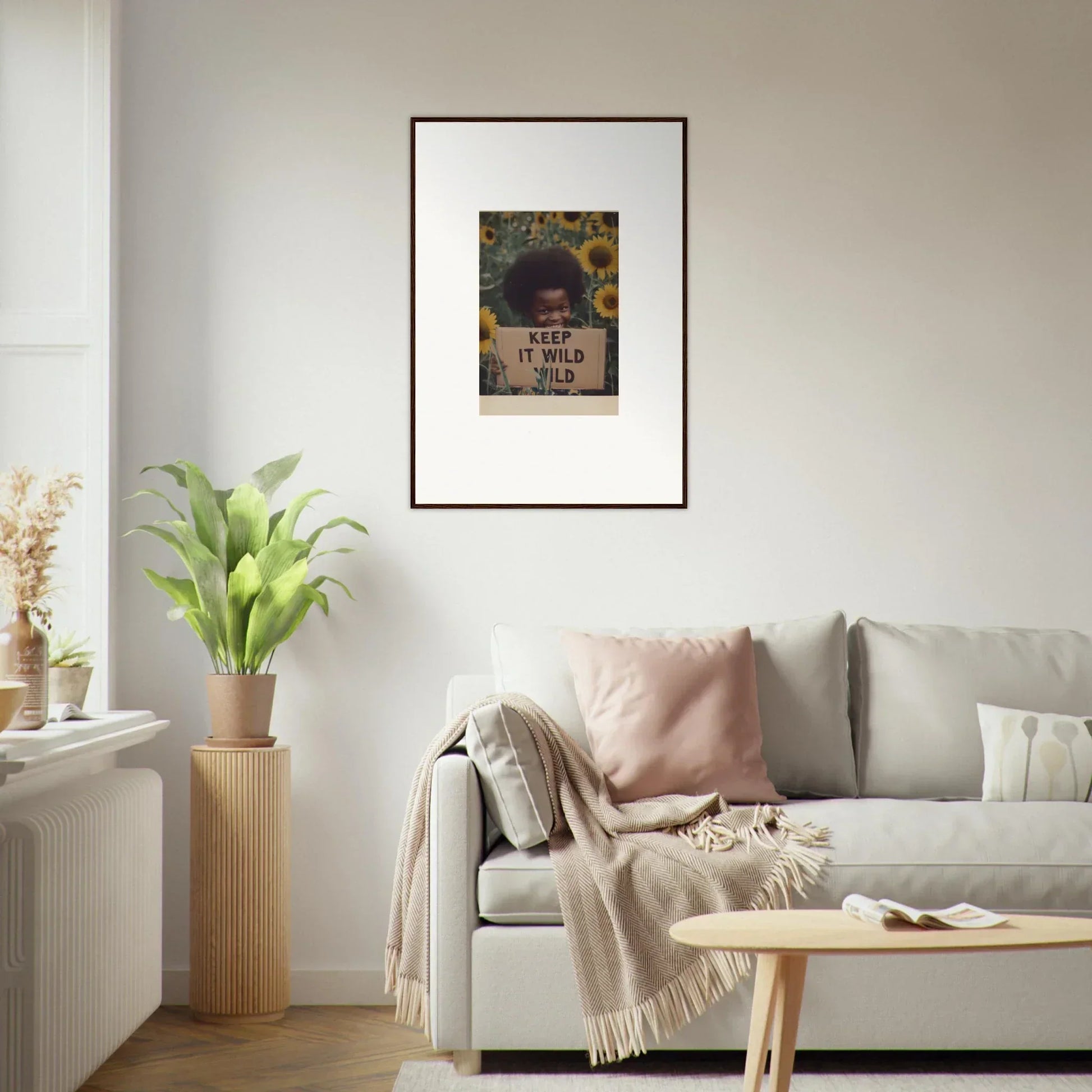 Framed Euphoric Sun Voyages artwork with sunflowers on a chic white wall