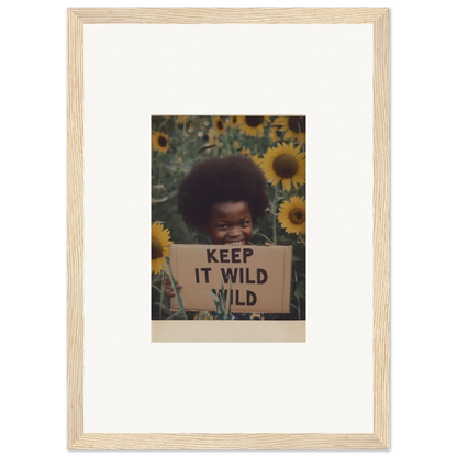 Framed photo of a person with a KEEP IT WILD sign in sunflowers for Euphoric Sun Voyages