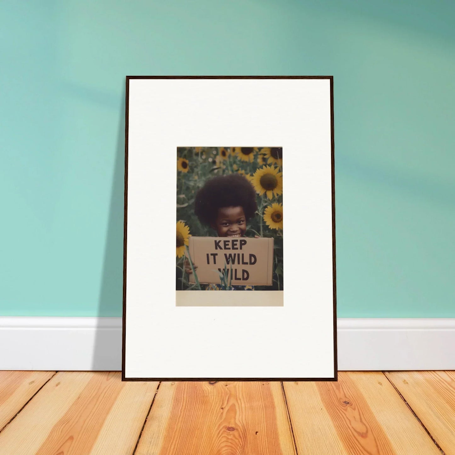 Framed art of protest sign KEEP IT WILD with sunflowers for Euphoric Sun Voyages