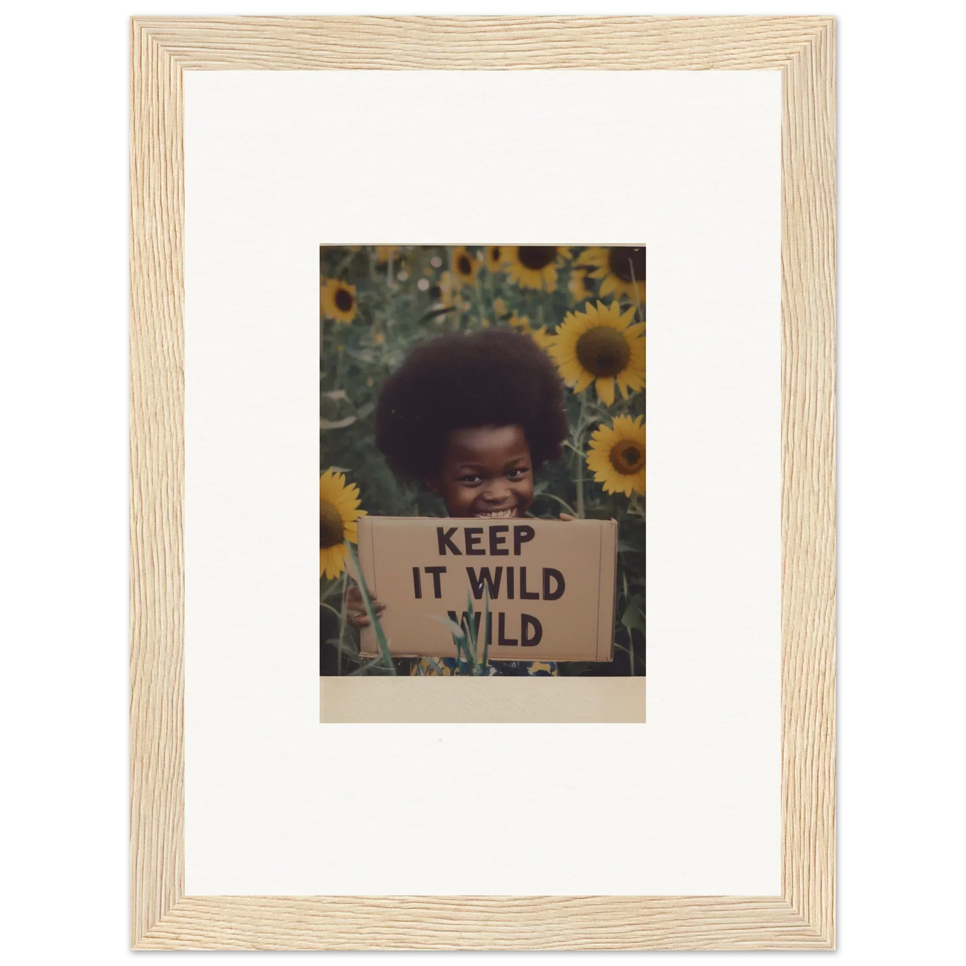 Framed photo of a Keep It Wild sign with sunflowers from Euphoric Sun Voyages