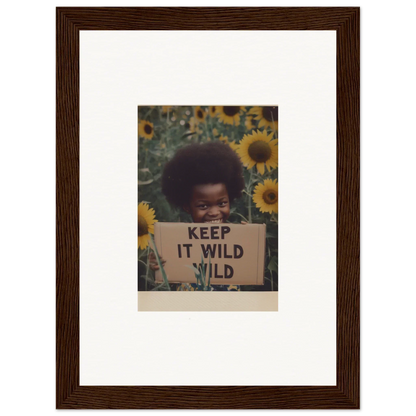 Framed photo of a protest sign saying KEEP IT WILD with sunflowers for Euphoric Sun Voyages