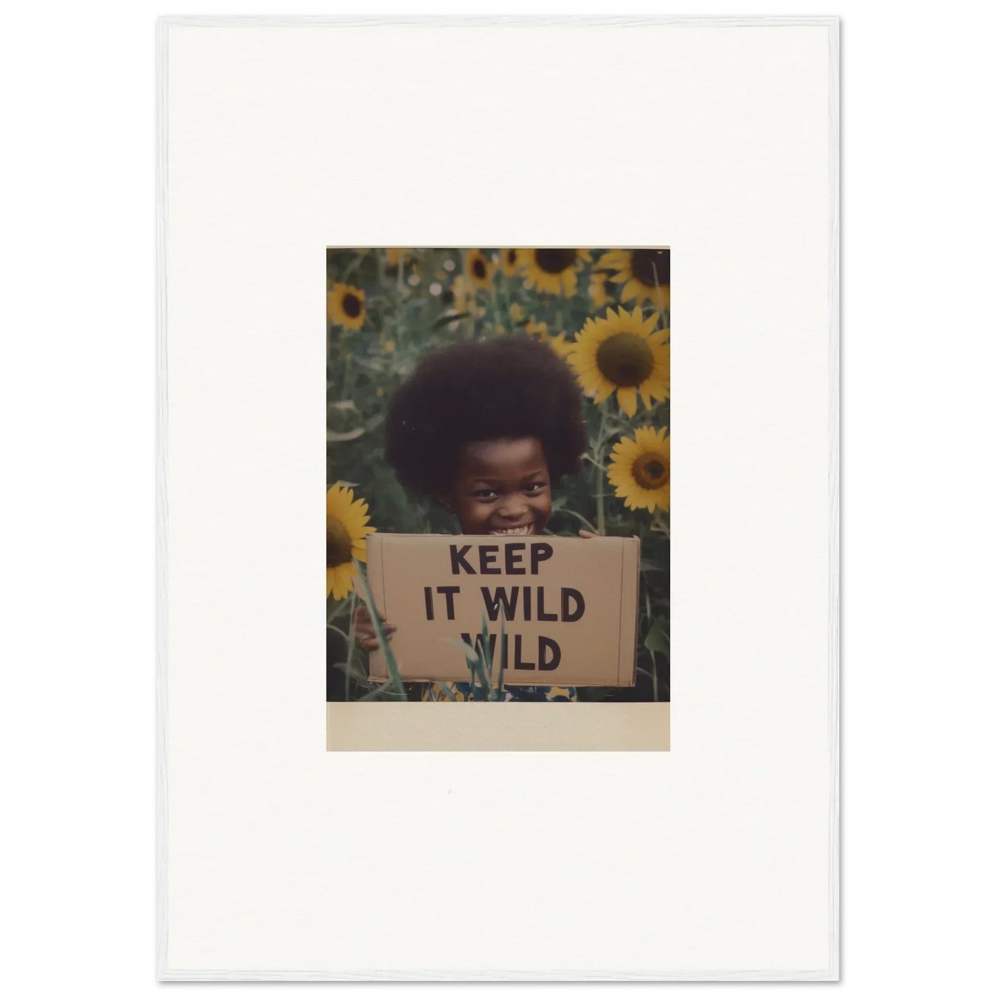 Vintage photo of a KEEP IT WILD sign amidst sunflowers for Euphoric Sun Voyages