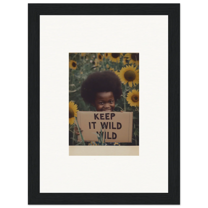 Framed photograph with a KEEP IT WILD sign surrounded by sunflowers from Euphoric Sun Voyages