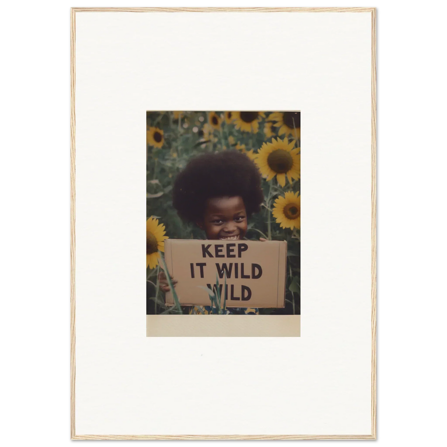 Framed photo of sunflowers with a KEEP IT WILD sign from Euphoric Sun Voyages