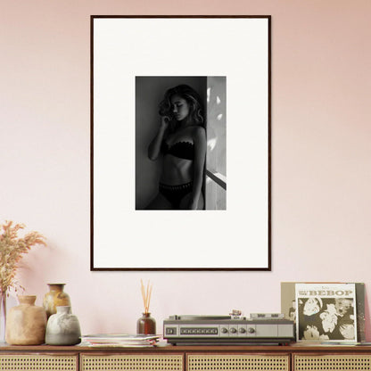 Framed black and white photograph of a woman in lingerie.