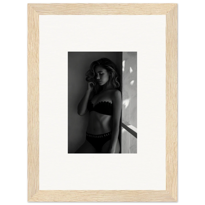 Framed black and white photograph of a woman in lingerie.