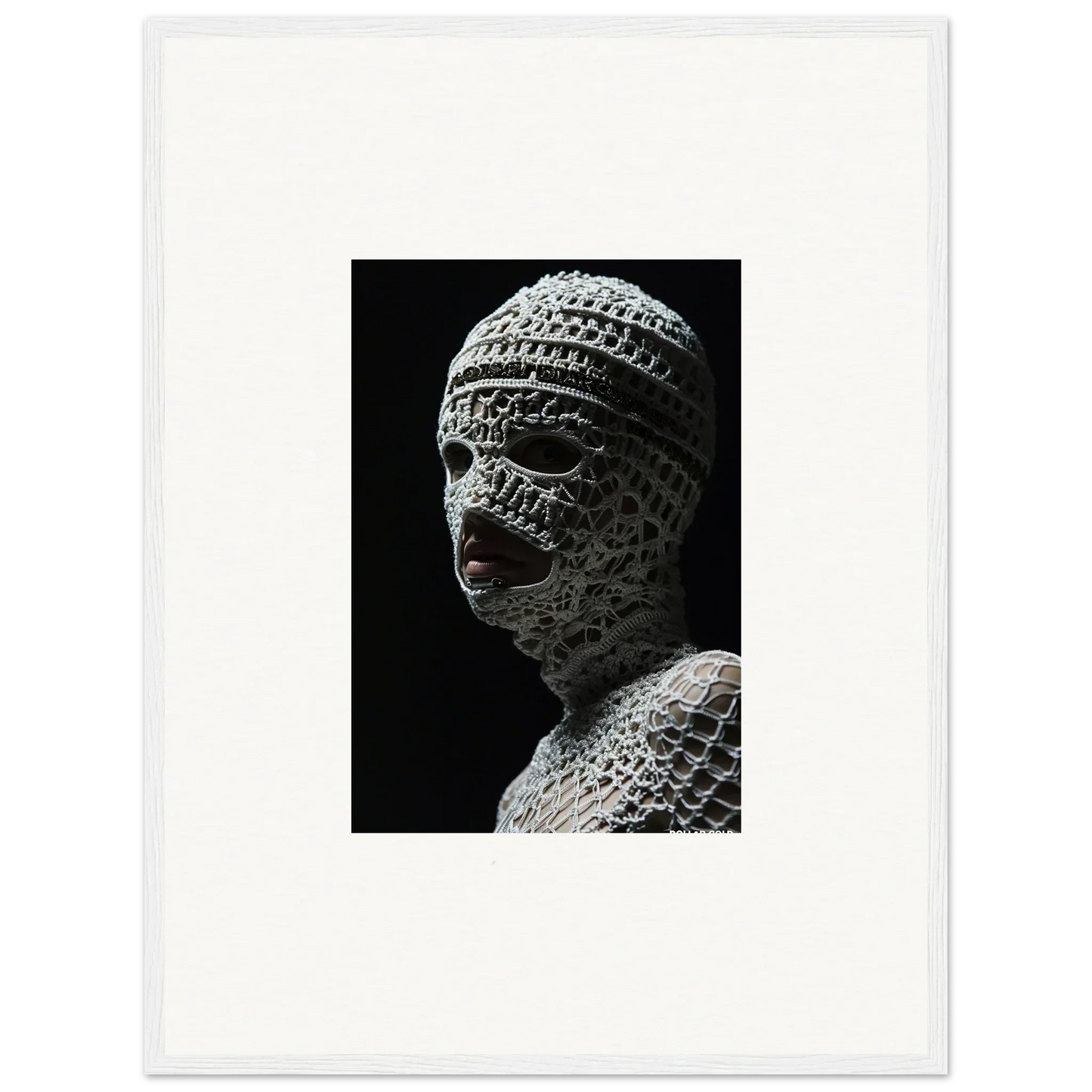 Sculpture of a head wrapped in bandages or textured material.