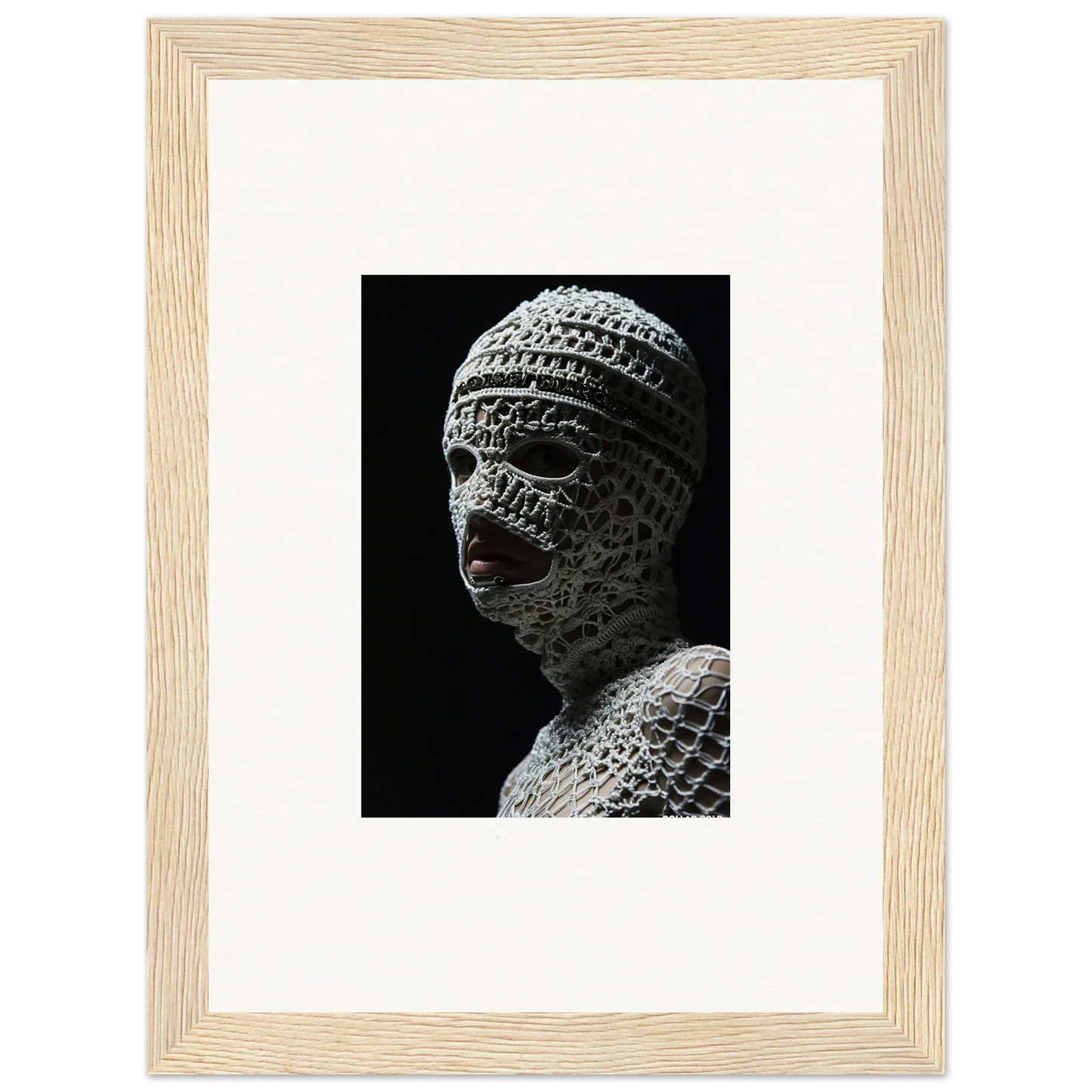 Sculpture of a head wrapped in bandages or cloth strips.