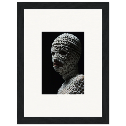 Sculpture of a head wrapped in bandages or textured material, with visible facial features.