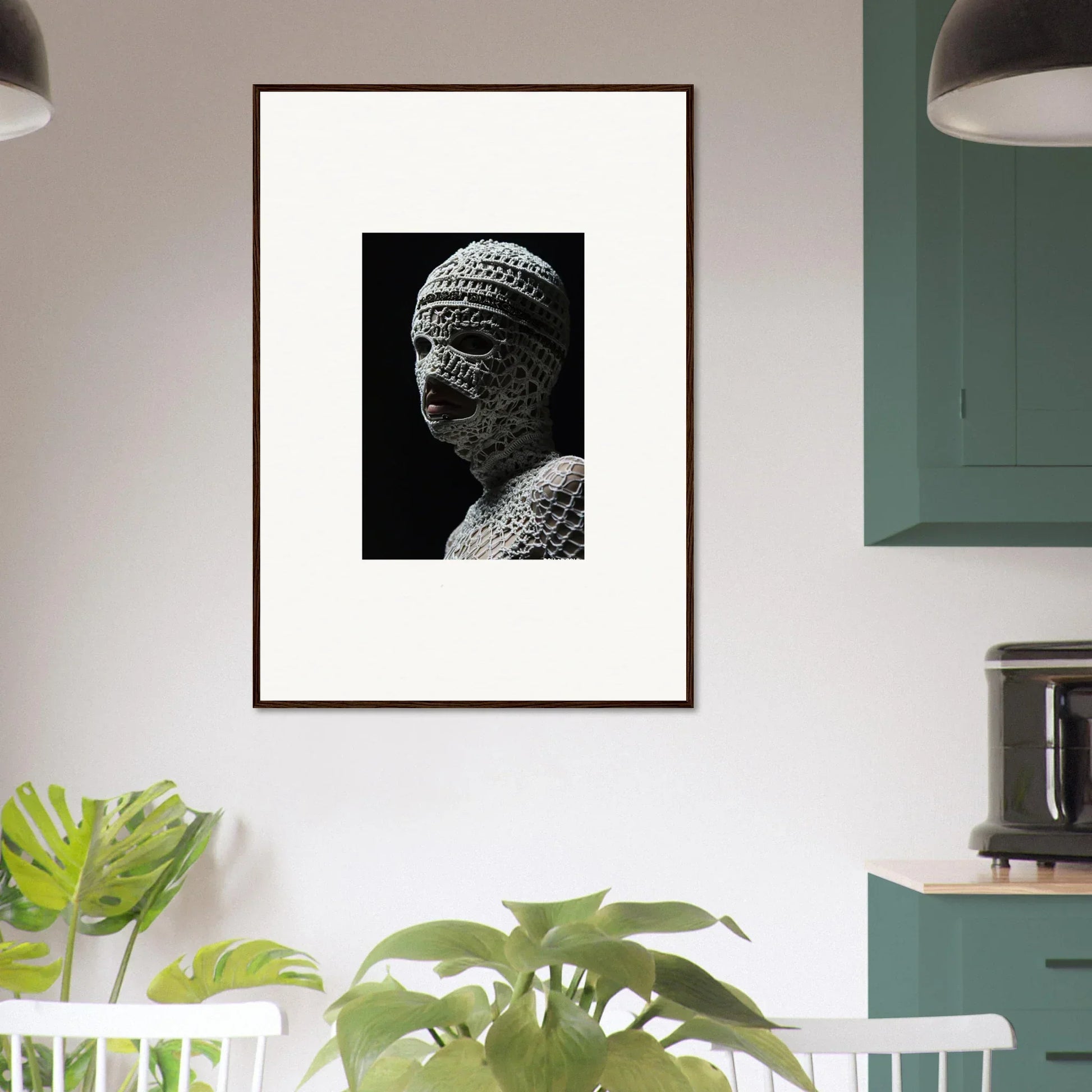 Framed black and white photograph of an ancient stone bust with intricate headwear.