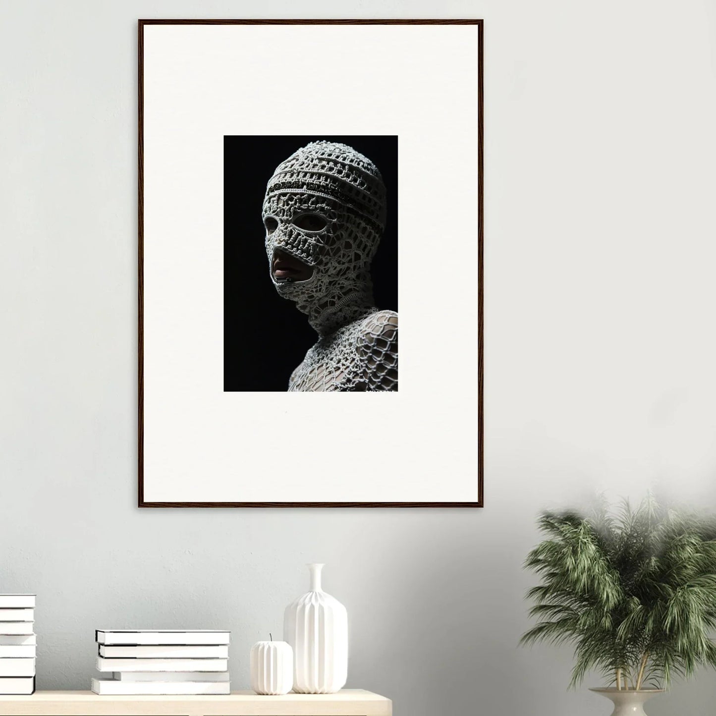 Framed black and white photograph of an ancient stone sculpture bust.