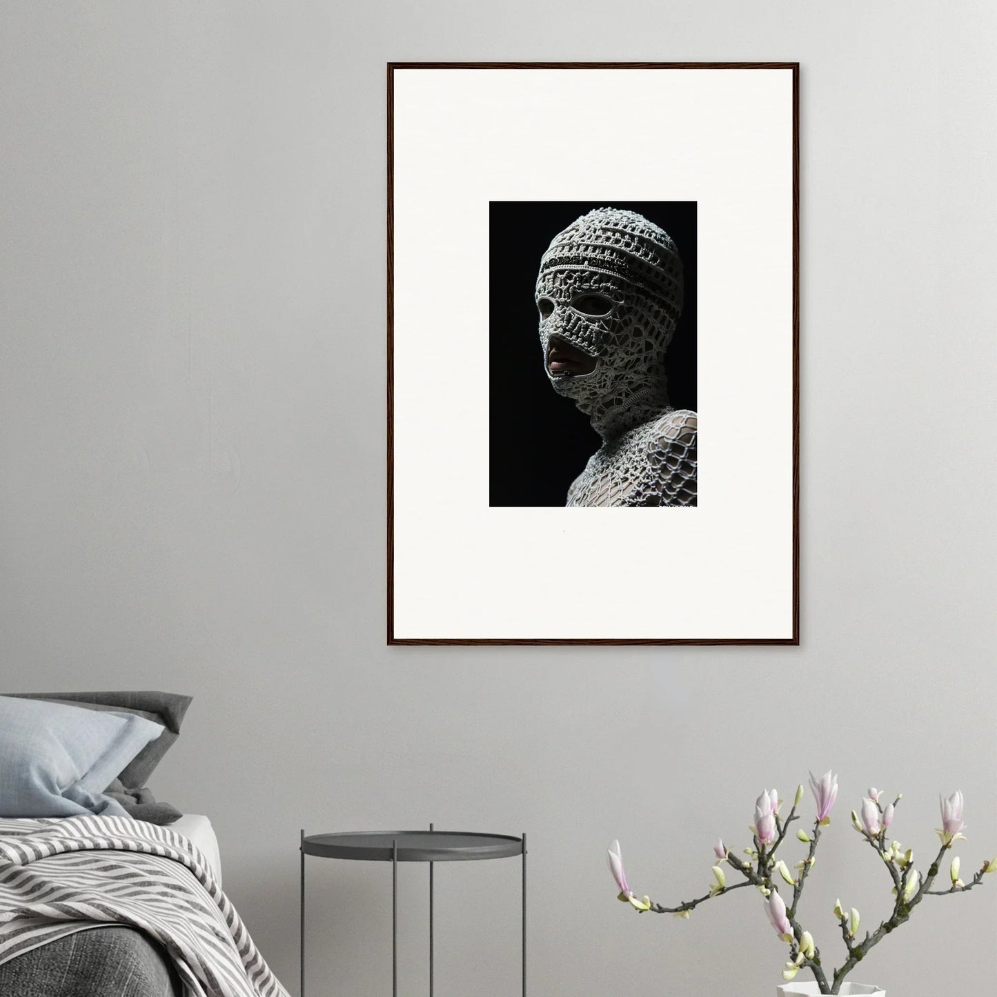 Framed black and white photograph of a sculptural bust with textured surface details.