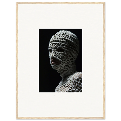 Sculpture of a head covered in intricate bandage-like wrappings.