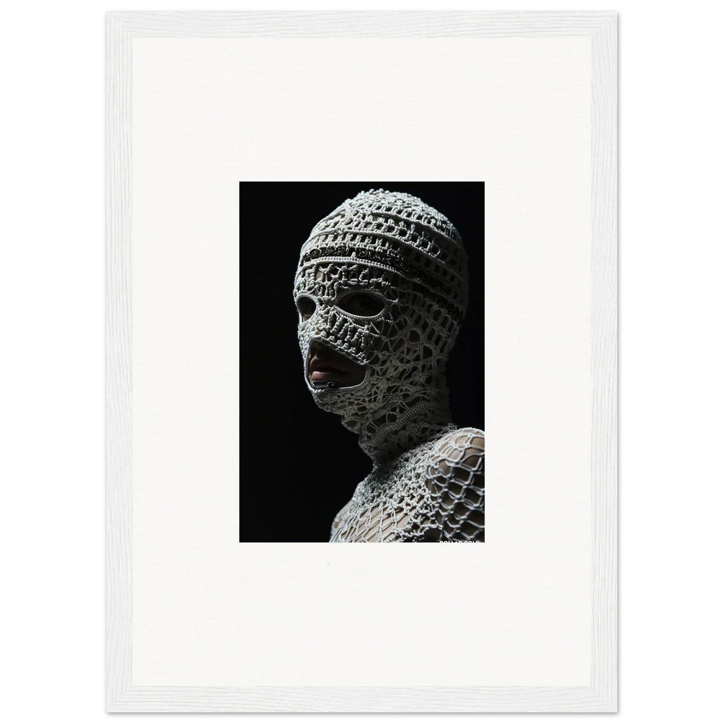 Sculpture of a head wrapped in bandages or textured material.