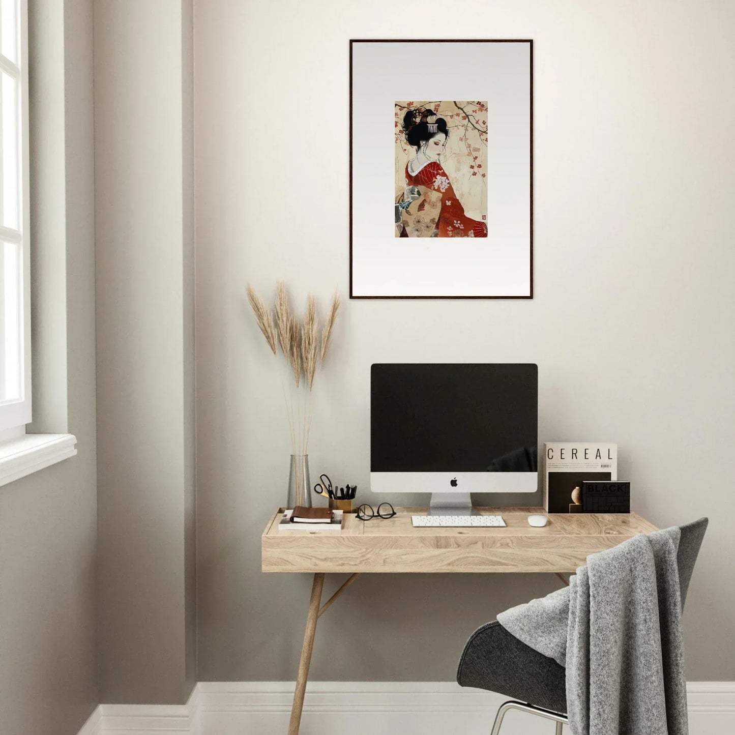 Minimalist wooden desk with iMac and Faux Devotion Complex framed wall art above