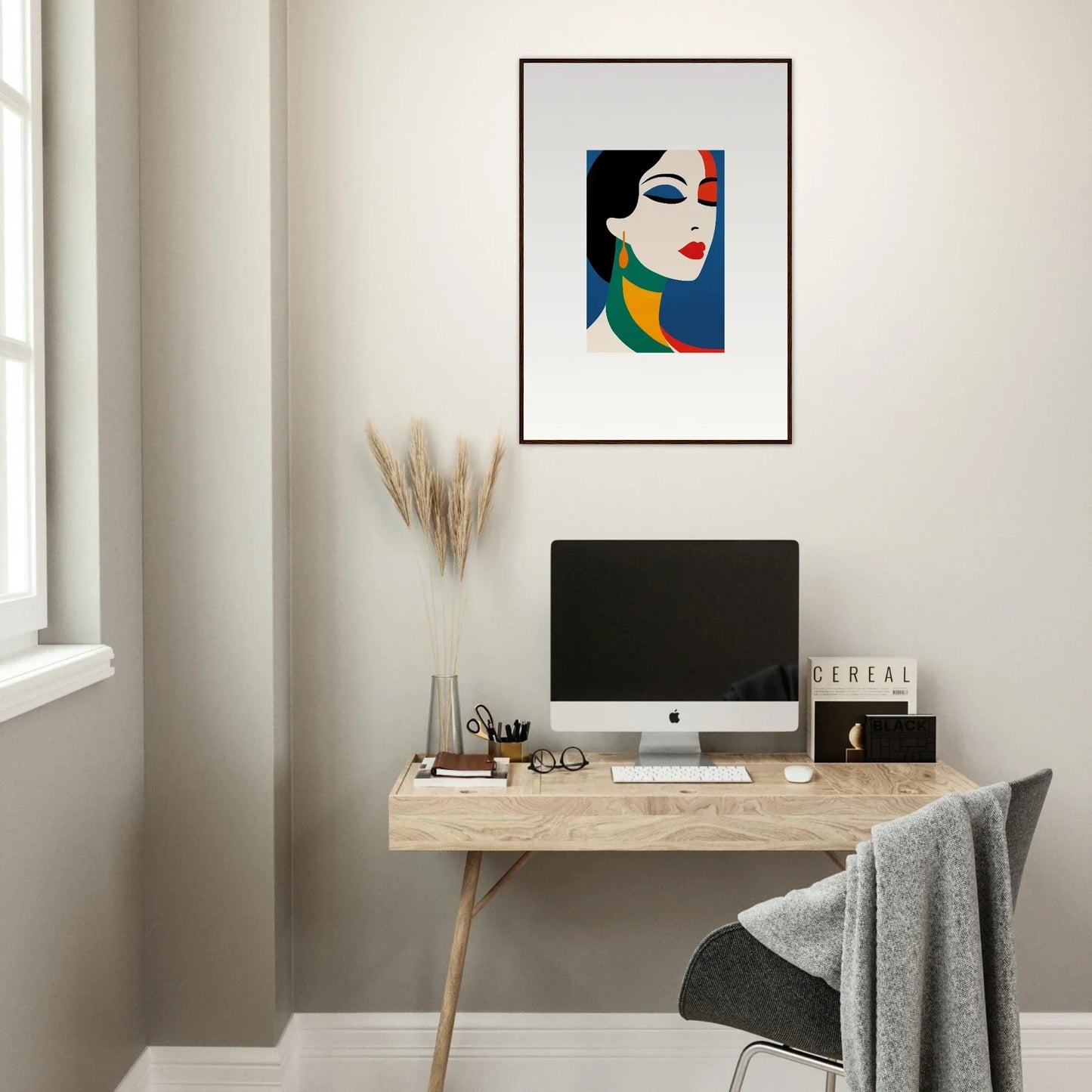 Minimalist home office with wall-mounted desk, computer, and Prism Reverie framed wall art