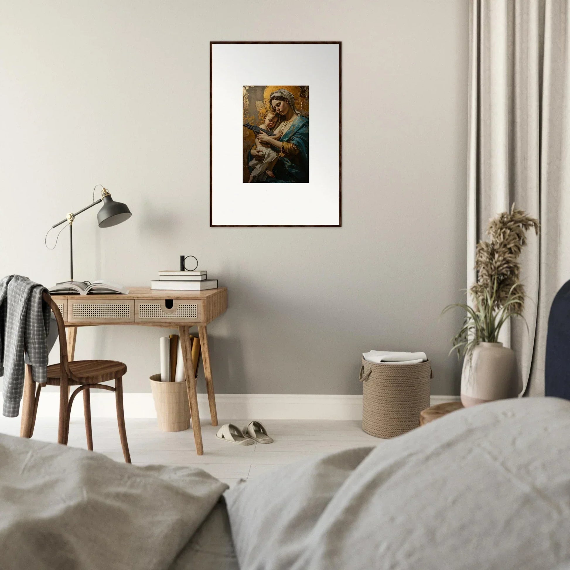 Framed wall art of a figure holding a baby for serene room decor