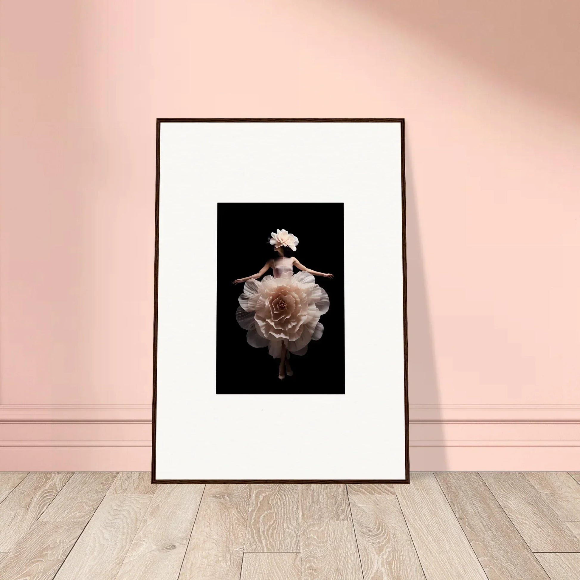 Framed photograph of a figure in a flowing white dress resembling a blooming flower.