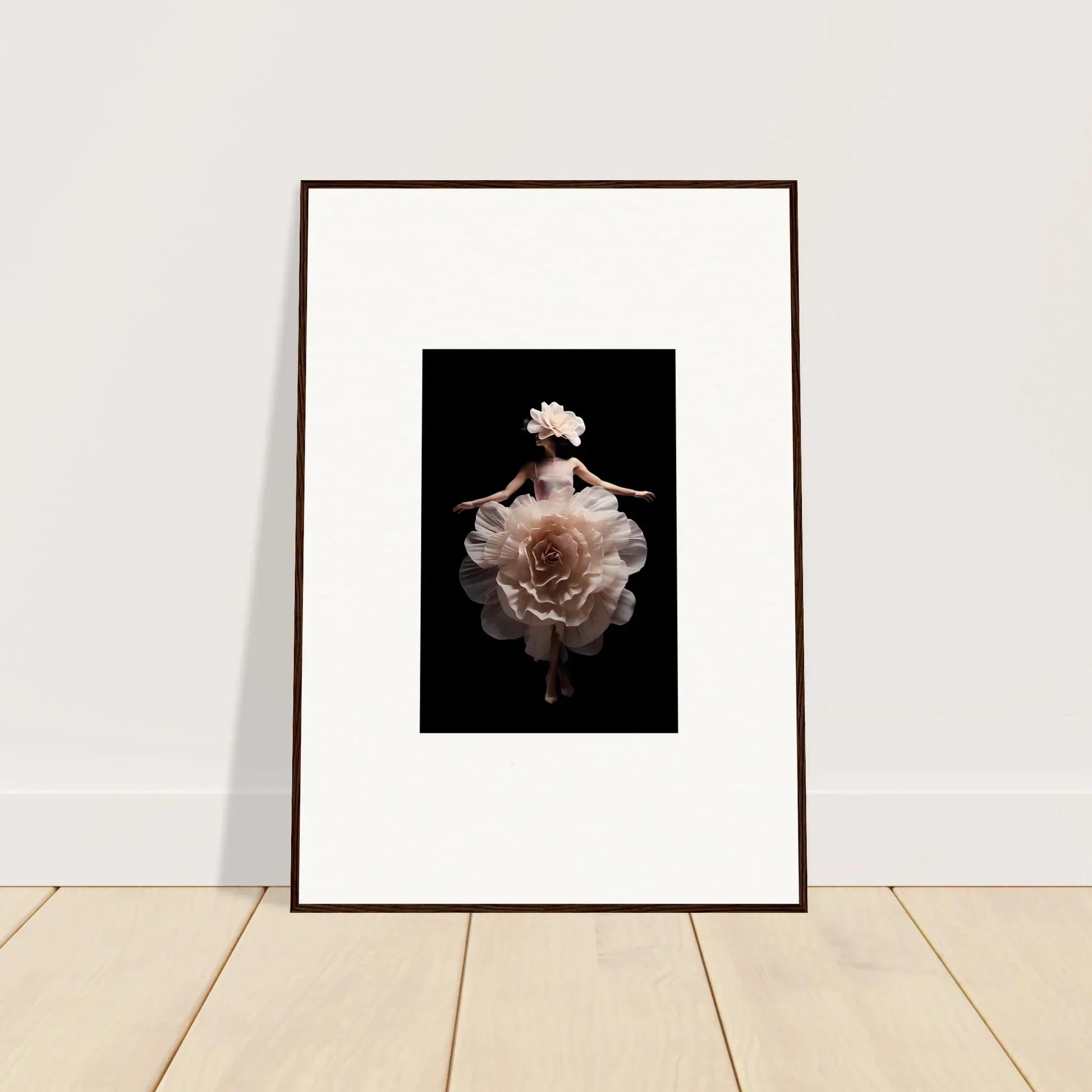 Framed artwork featuring a pale rose bloom against a dark background.