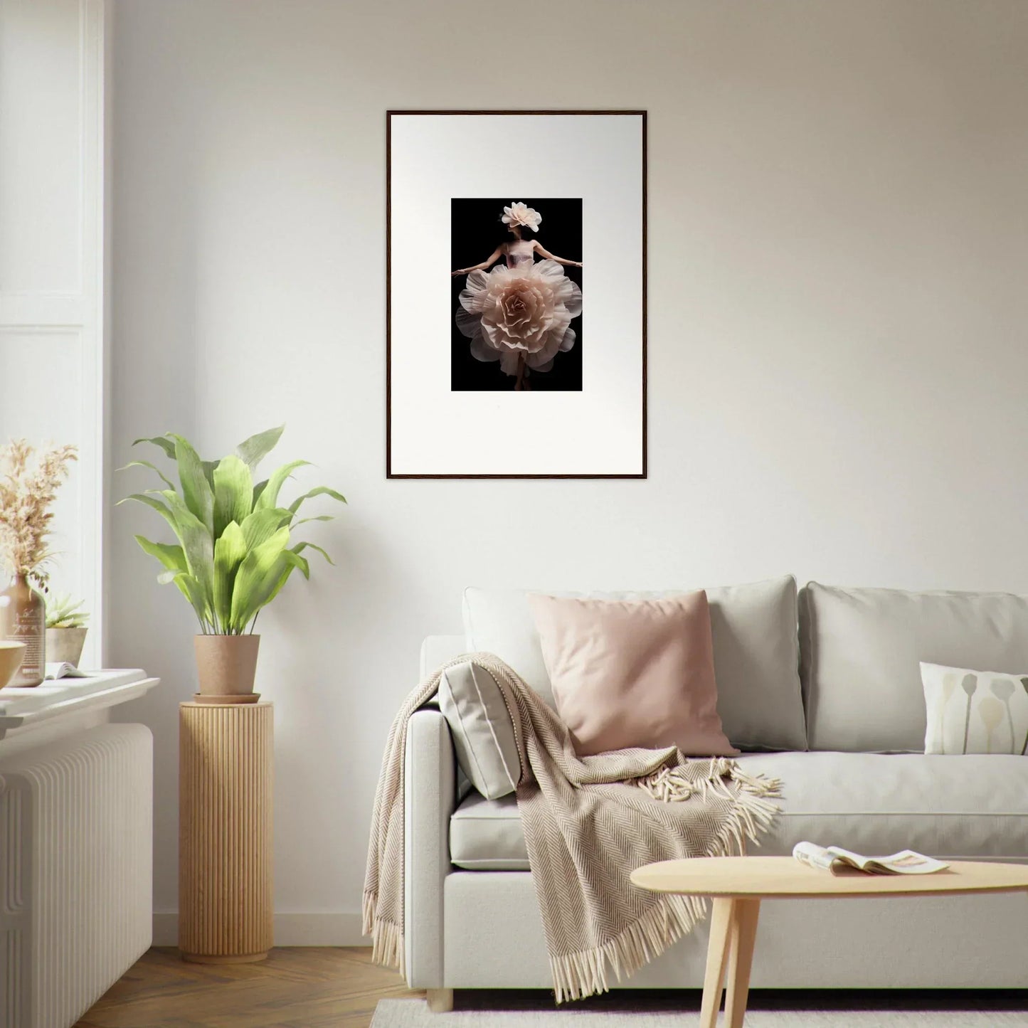 Framed black and white photograph of a person holding a large rose.