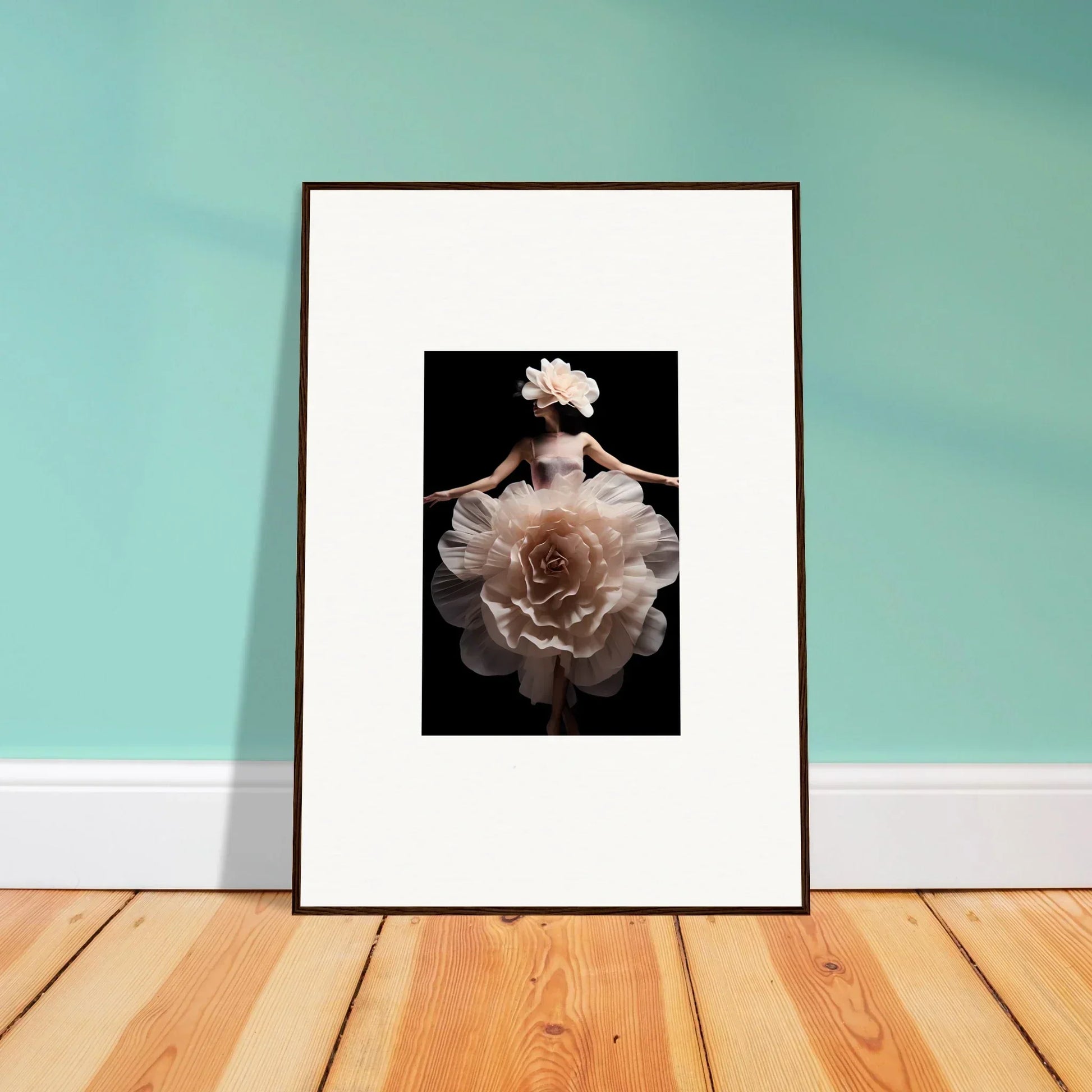 Framed photograph of a person wearing a voluminous floral dress against a dark background.