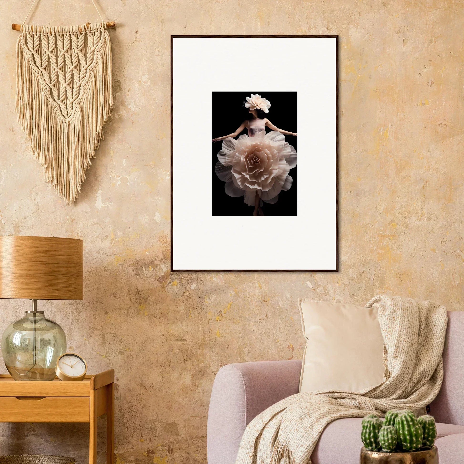 Framed photograph of a pale rose against a dark background.