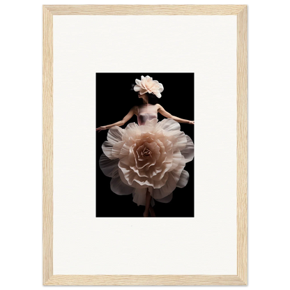 Framed artistic photograph of a figure wearing a dress resembling a blossoming rose.