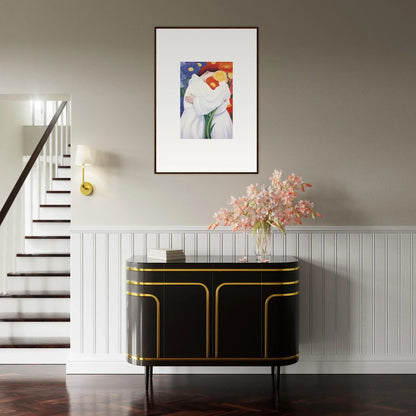 Elegant black sideboard with gold trim enhancing room decor and complementing framed wall art