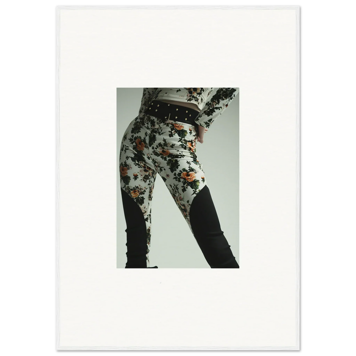 Floral-patterned pants or leggings worn on a person’s lower body.