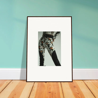 Framed black and white photograph of floral-patterned pants legs.